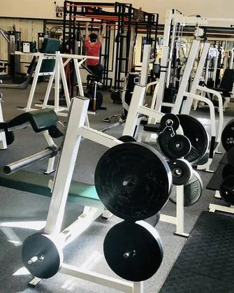 Member training in the free-weight area at HFH gym in Waupaca, WI